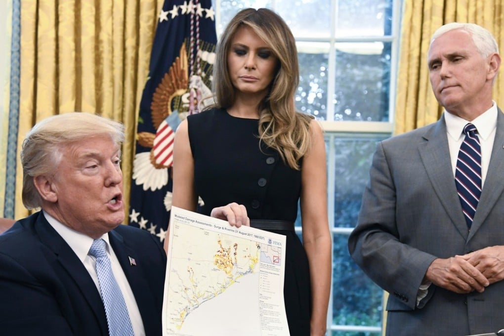 US President Donald Trump holds a map of the Texas Gulf coast. Photo: Bloomberg