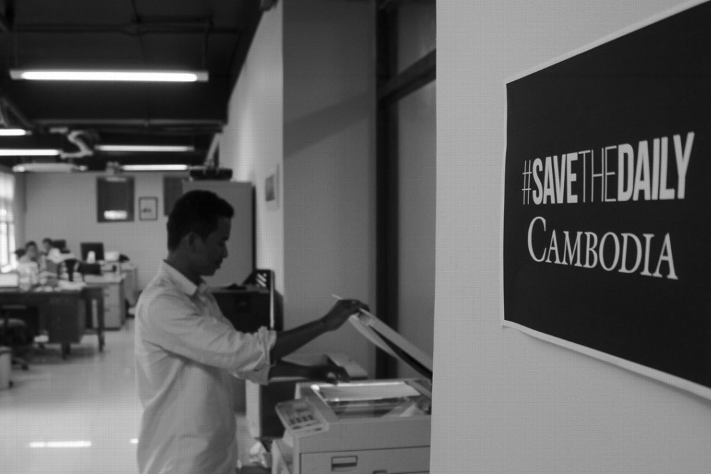 Chansy Chhorn, The Cambodia Daily’s news editor, photocopying in the offices. Photo: Nathan A. Thompson