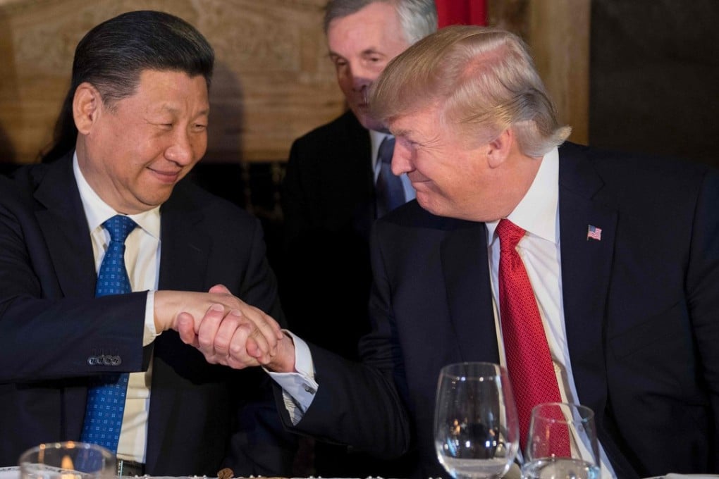 US President Donald Trump (right) and Chinese President Xi Jinping engage in a convivial handshake during dinner at Trump’s Mar-a-Lago estate in West Palm Beach, Florida this past spring. Photo: AFP