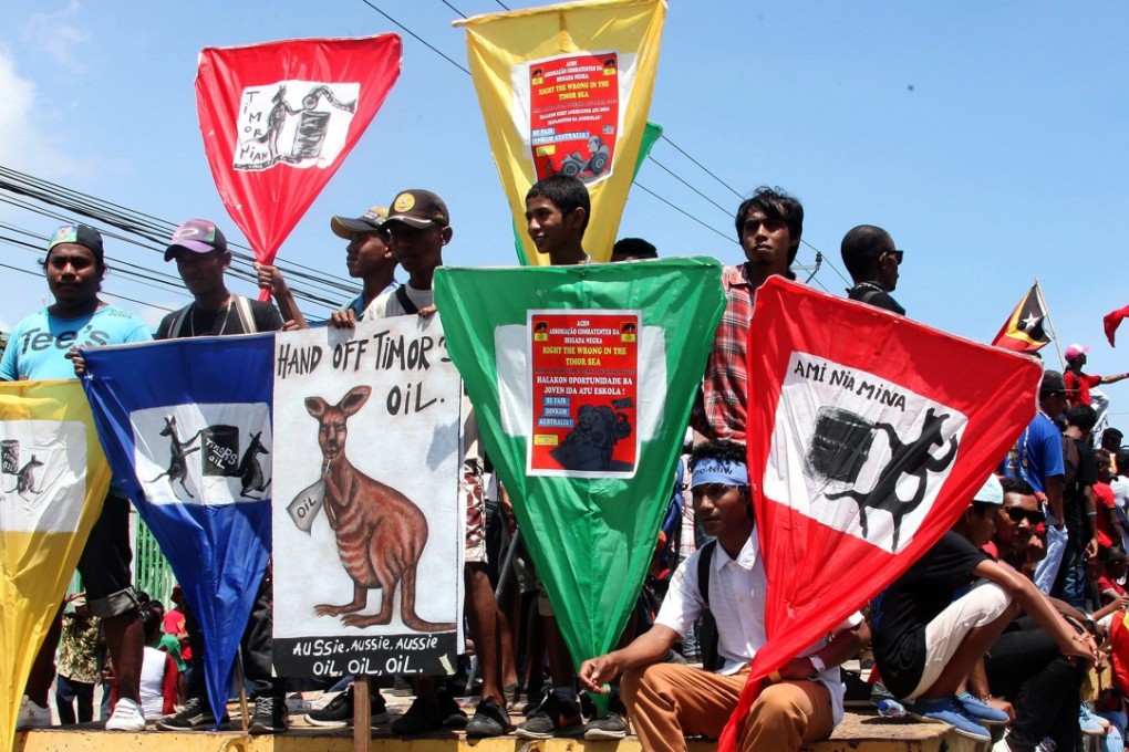 East Timorese students hold banners during a protest demanding dialogue between the Australian and East Timor governments to resolve a boundary dispute. Photo: EPA