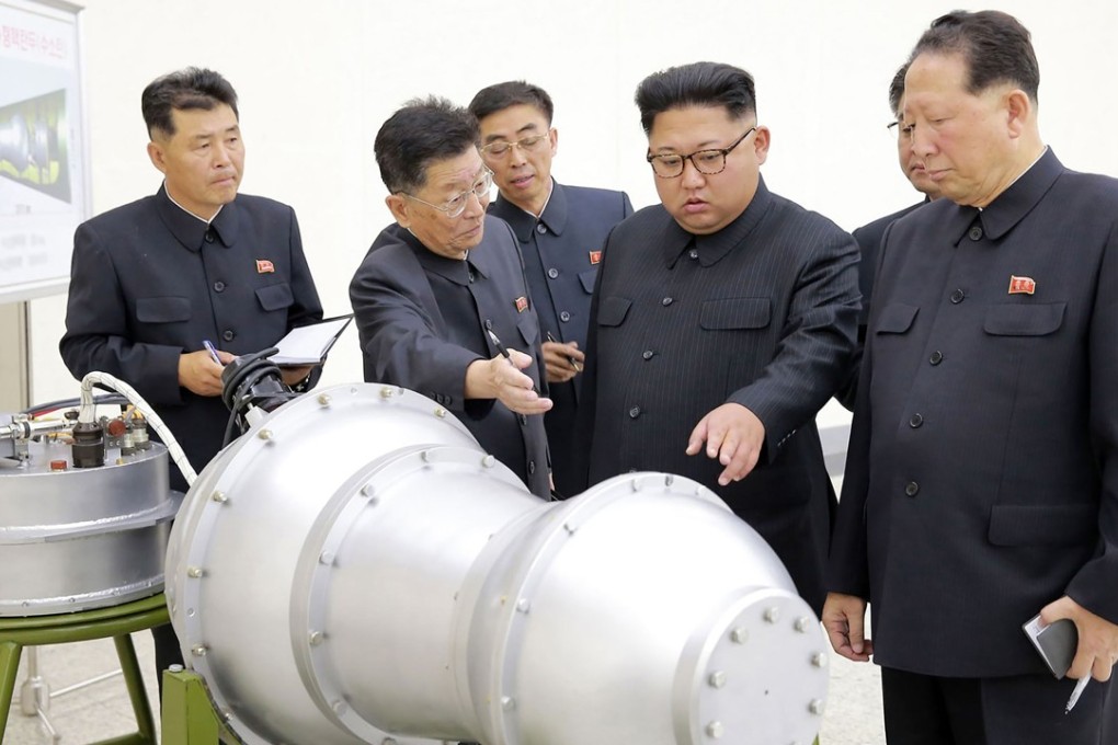 Kim Jong-un talking to his nuclear technicians. Photo: Reuters