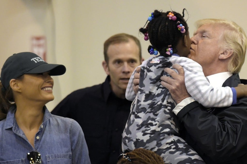 US President Donald Trump and Melania Trump meet people impacted by Hurricane Harvey during a visit to the NRG Centre in Houston. Photo: AP