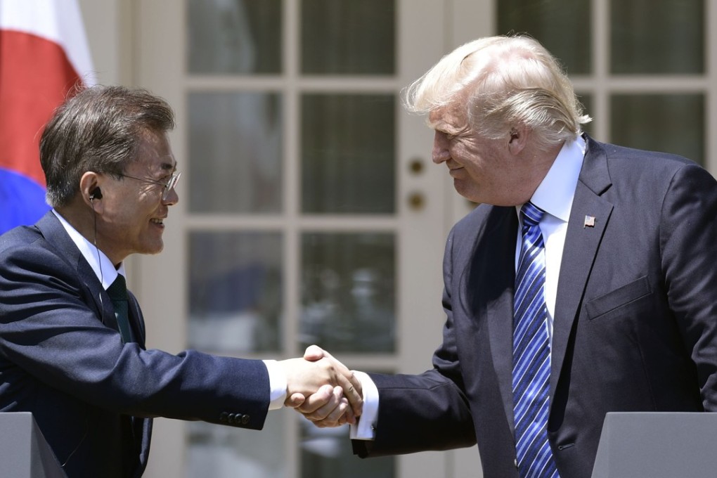 US President Donald Trump shakes hands with South Korean President Moon Jae-in at the White House. File photo: AFP