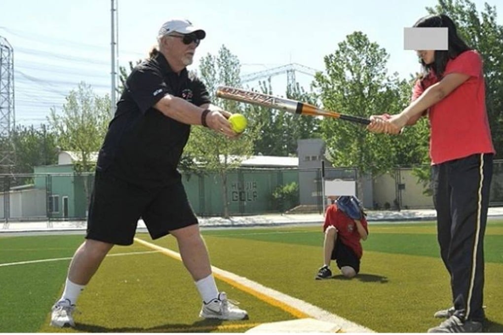 Robert Robertson coaching softballers at Beijing Huijia Private School, where he also coached girls in volleyball and soccer, and taught phys ed and communications. There is no suggestion Robertson had improper relationships with any students at Huijia. Photo: Beijing Huijia Private School