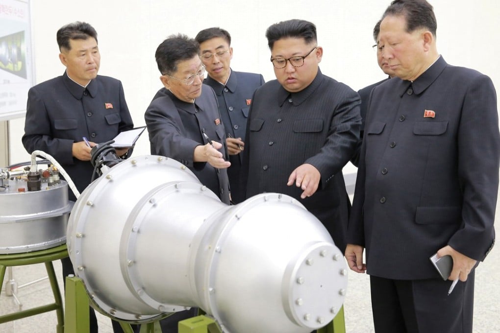 North Korean leader Kim Jong-un, second right, inspects what is purported to be a miniaturised hydrogen bomb in this undated photo released by North Korea's Korean Central News Agency on Sunday. Photo: Reuters