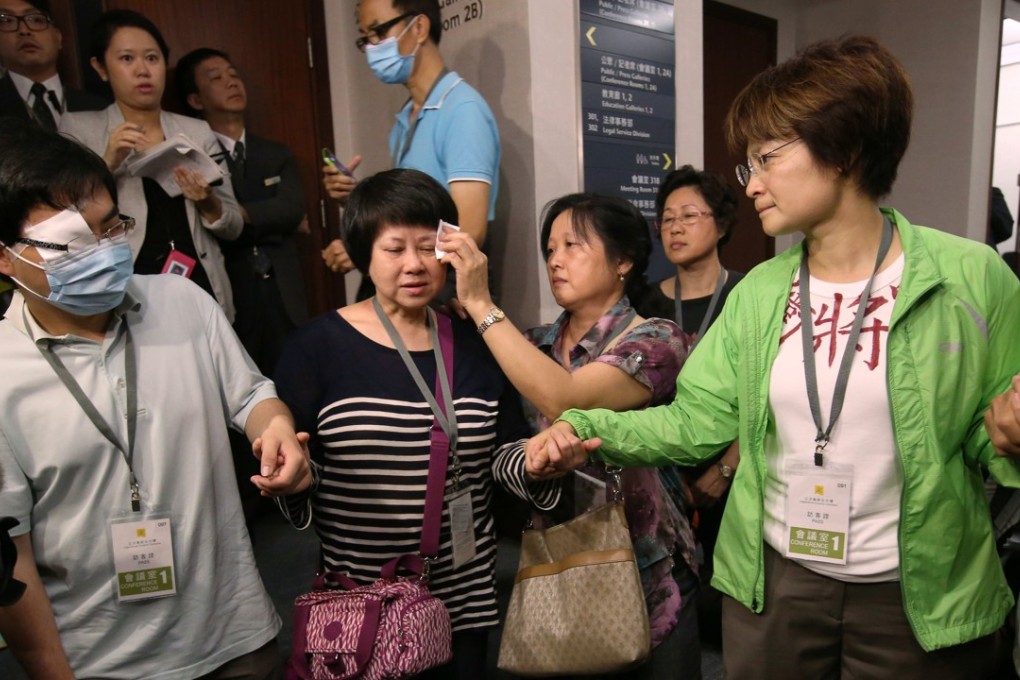 Sai Kung district councillor Christine Fong Kwok-shan (right) and about 10 residents went down on their knees to ask the government and pro-establishment legislators to halt plans to expand the Tseung Kwan O landfill in 2014. Photo: Handout