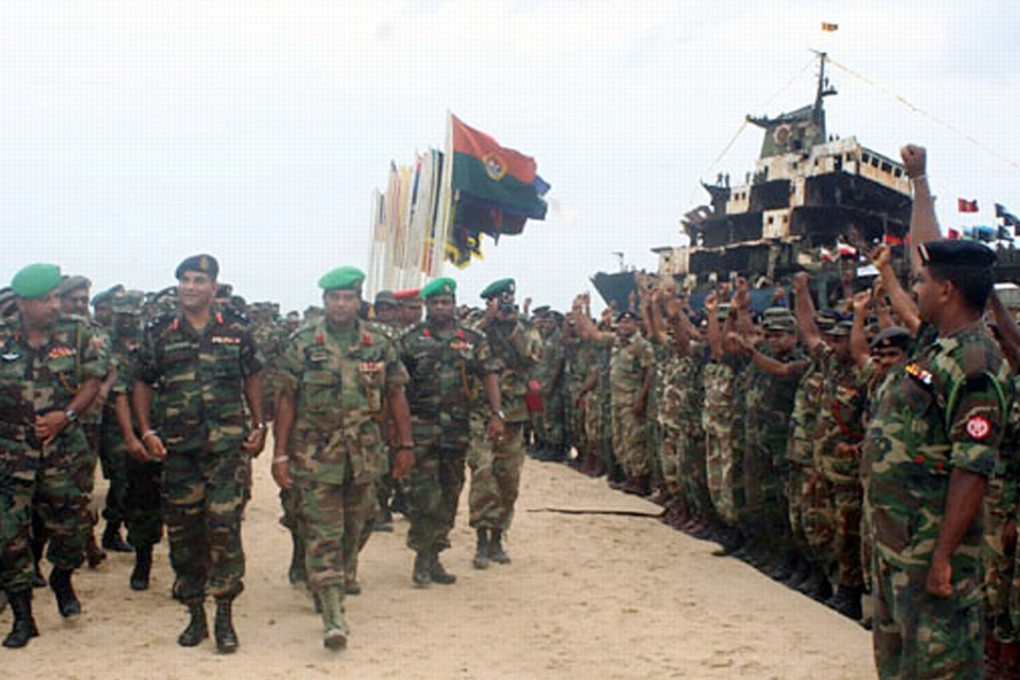 Soldiers from the Sri Lankan army celebrate their victory over the Liberation Tigers of Tamil Eelam (LTTE) in 2009. Photo: Reuters