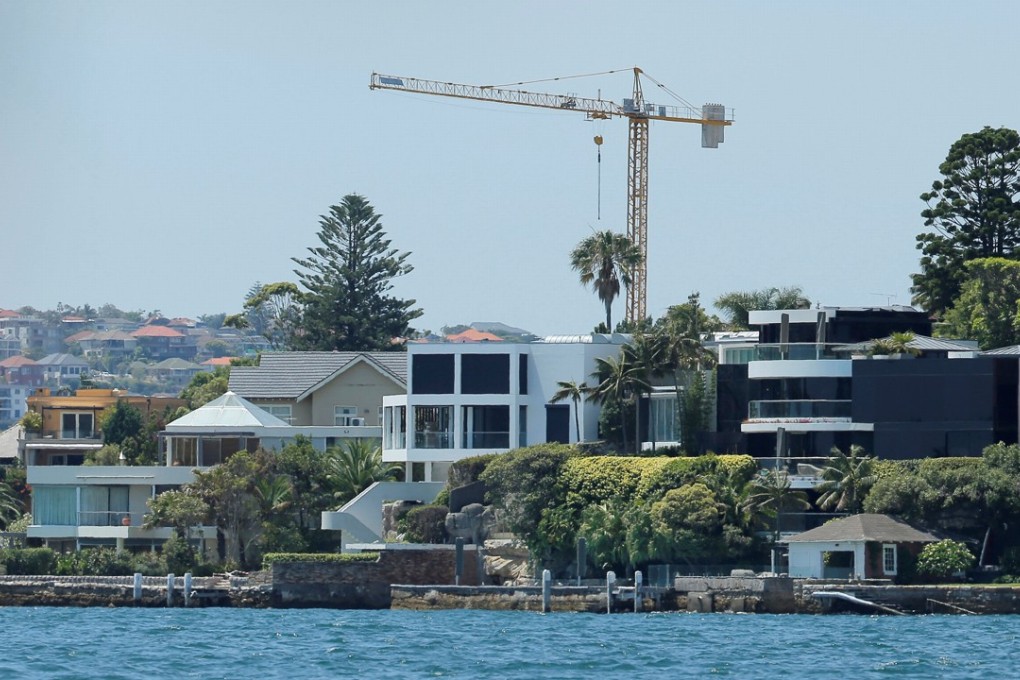 Growth in Australia’s home prices slowed in August, dampened by the flat and slight growths in Sydney and Melbourne. Prices for Sydney properties such as these over waterfront were flat, compared with 1.4 per cent rise in July. Photo: Reuters