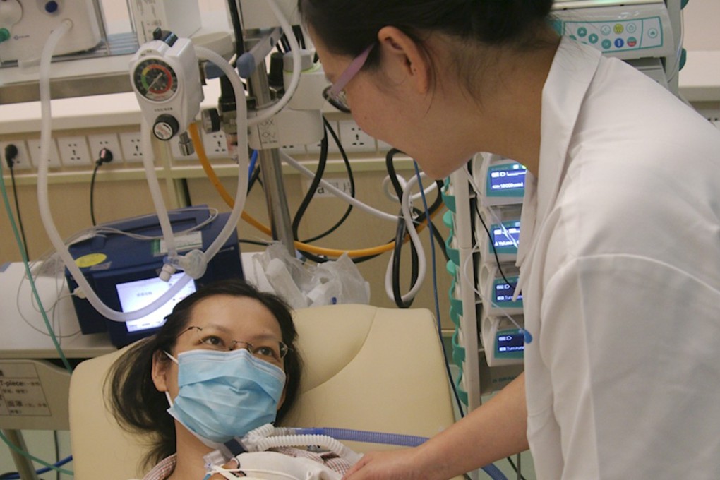 A nurse cares for a mother and her 56 day old baby at HKU-Shenzhen hospital. Photo: Stuart Heaver