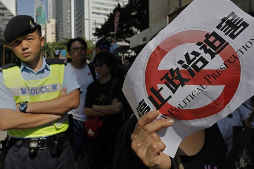 A protester taking part in a rally last month alleges that the recent jailing of three pro-democracy activists was political persecution. When disagreement over a court ruling strays into attacking a legitimate process of law, such as a prosecutor’s right of appeal, it is the rule of law itself being attacked. Photo: AP