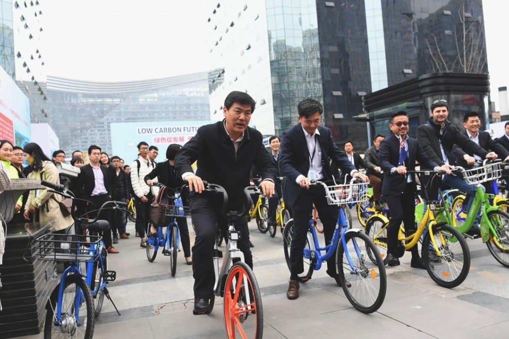 Chengdu city officials at the launch of a bike-sharing scheme in the city – which is trying to improve its green credentials. Photo: ImagineChina