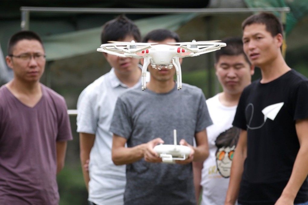 A trainee practises with a drone at the LFTY school in Beijing. Photo: Reuters