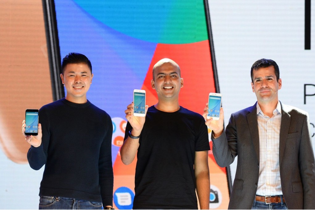 Donovan Sung, director of product management and marketing at Xiaomi Global (left), Manu Jain, managing director of Xiaomi India (centre), and global director of Android Partner Programmes Jon Gold hold the newly launched Xiaomi Mi A1 smartphone at its launch in New Delhi. Photo: AFP