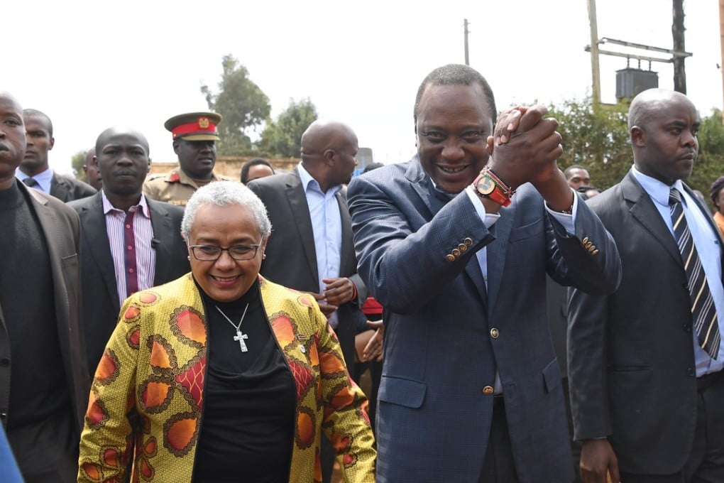 President Uhuru Kenyatta, centre front, arrives at a polling station on August 8 to cast his ballot in Gatundu in Kenya, in a presidential election that was later annulled. Photo: Xinhua