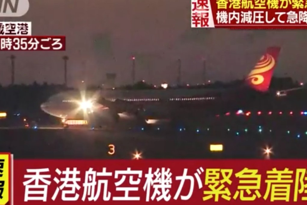 A TV news channel shows images of the plane, after it returned to Sapporo. Photo: Handout