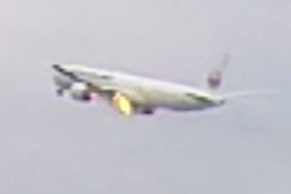 Flames were seen coming from the left engine of the Boeing 777, which had departed the airport soon after 11am. Photo: TBS News