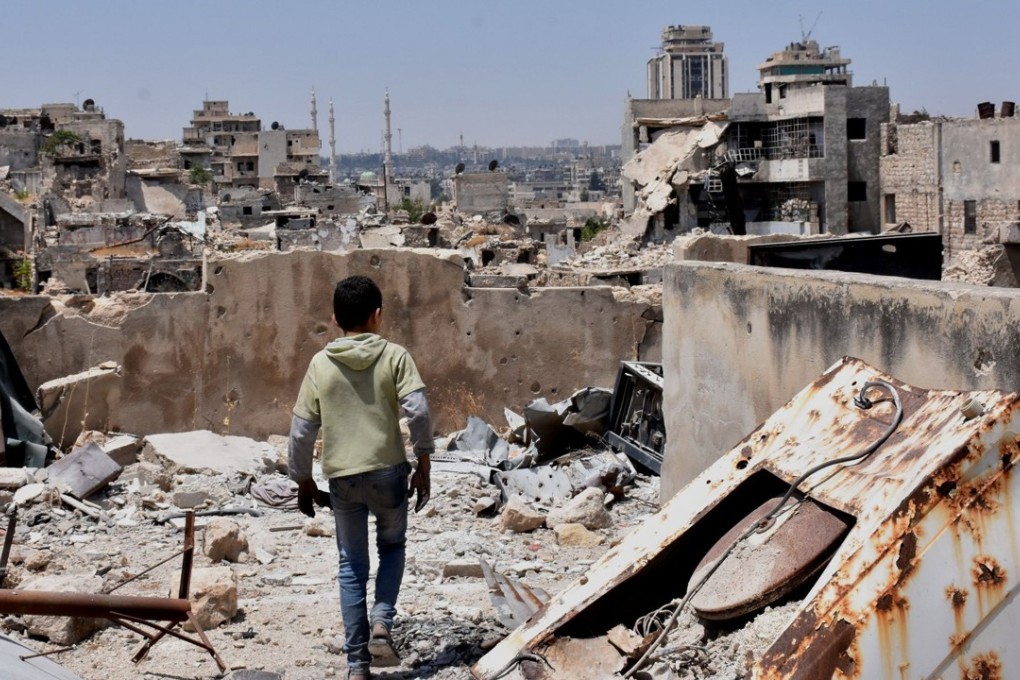 A Syrian boy walking amid the rubble of destroyed buildings in the northern city of Aleppo. Photo: AFP