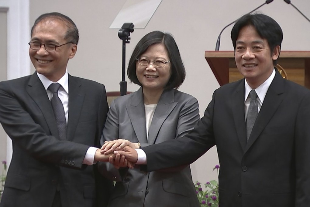Taiwan’s President Tsai Ing-wen (centre) holds hands with outgoing premier Lin Chuan (left) and his successor William Lai Chin-te on Tuesday in Taipei. Photo: AP