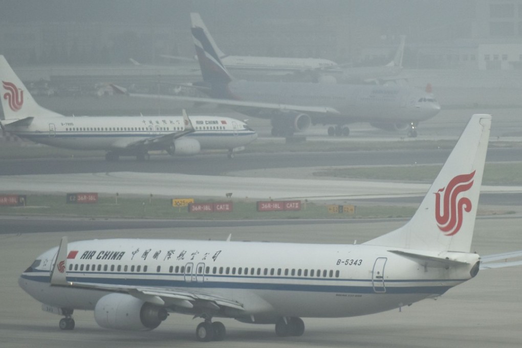 Planes wait to take off on a polluted day at Beijing airport last Friday. Photo: AFP