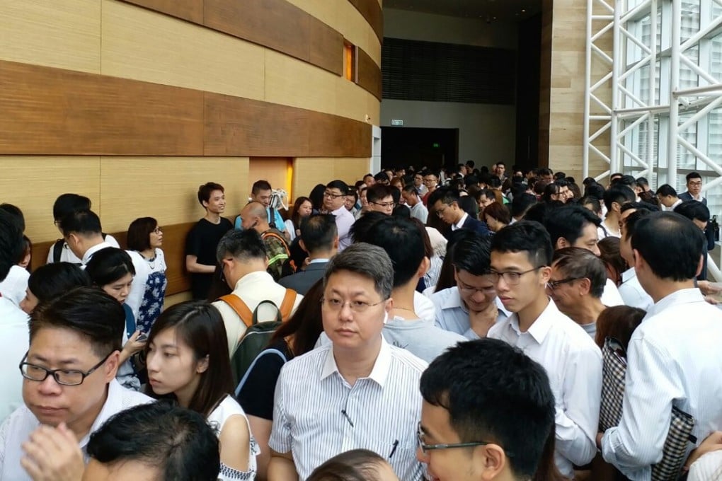 Long odds: More than 1,000 home seekers queued for the chance to get their hands on just four flats in Parc City, Tsuen Wan. Photo: Peggy Sito