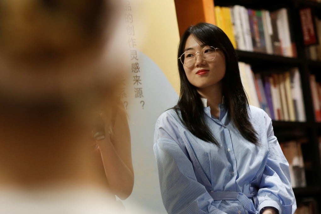 Writer Zhao Zengliang attends a book presentation and discussion at a bookstore in Beijing. Zhao adopts a pessimistic and dark humour in her work. Photo: Reuters