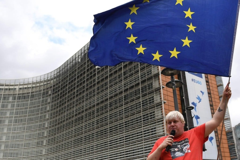 Anti-Brexit activist Drew Galdron, who is an impersonator of British Foreign Minister Boris Johnson, takes part in a demonstration in front of the European institutions in Brussels on Tuesday. Photo: AFP