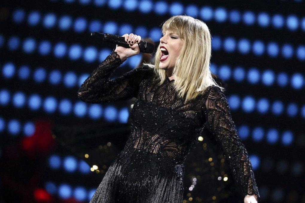 Taylor Swift performs in Houston. Her single ended the 16-week reign at the top of US charts by Despacito. Photo: AP