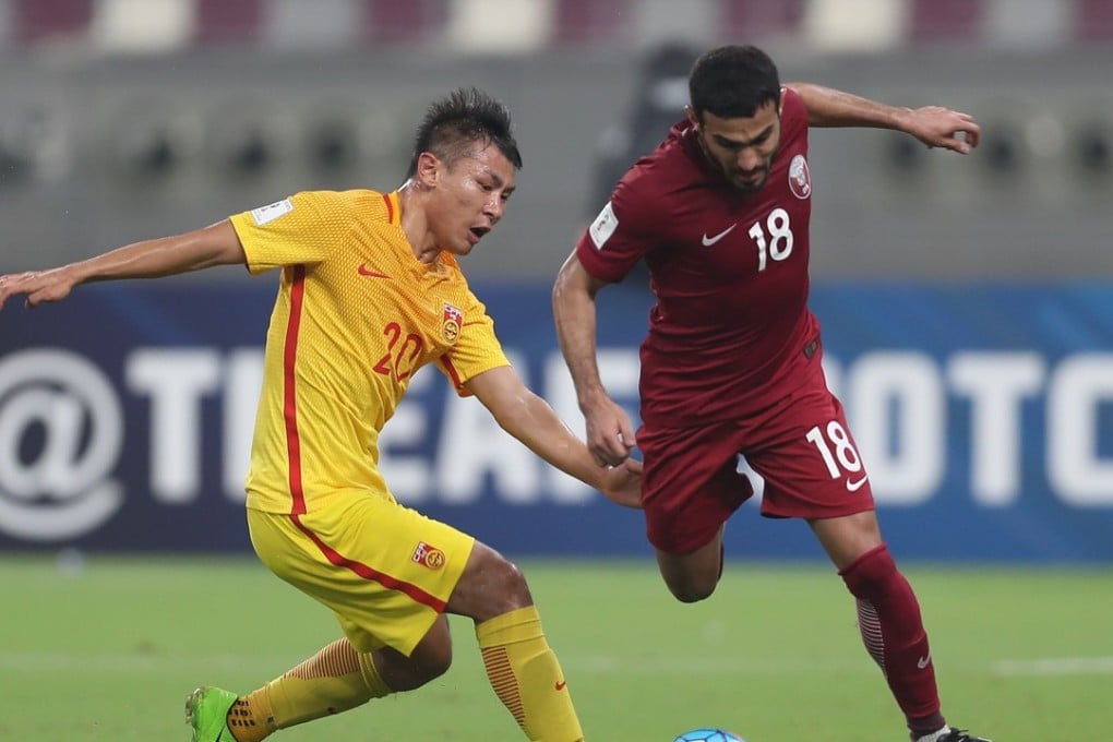 China's Yu Hanchao (R) and Qatar's Abdulkareem Salem fight for the ball during the Fifa World Cup 2018 qualification football match between Qatar and China at the Jassim Bin Hamed Stadium in Doha on September 5, 2017. China's faint hopes of qualifying for next year's World Cup finals in Russia finally ended, despite securing the victory they needed in Qatar. Photo: AFP