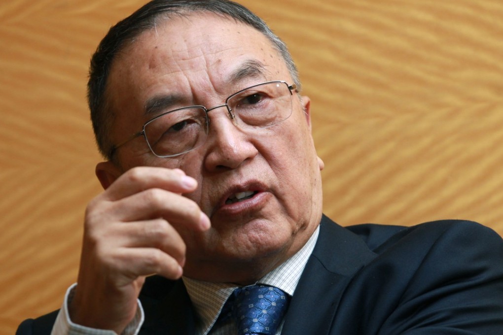 Legend Holdings chairman Liu Chuanzhi, poses for a photograph at Four Seasons Hotel in Central. Photo: May Tse