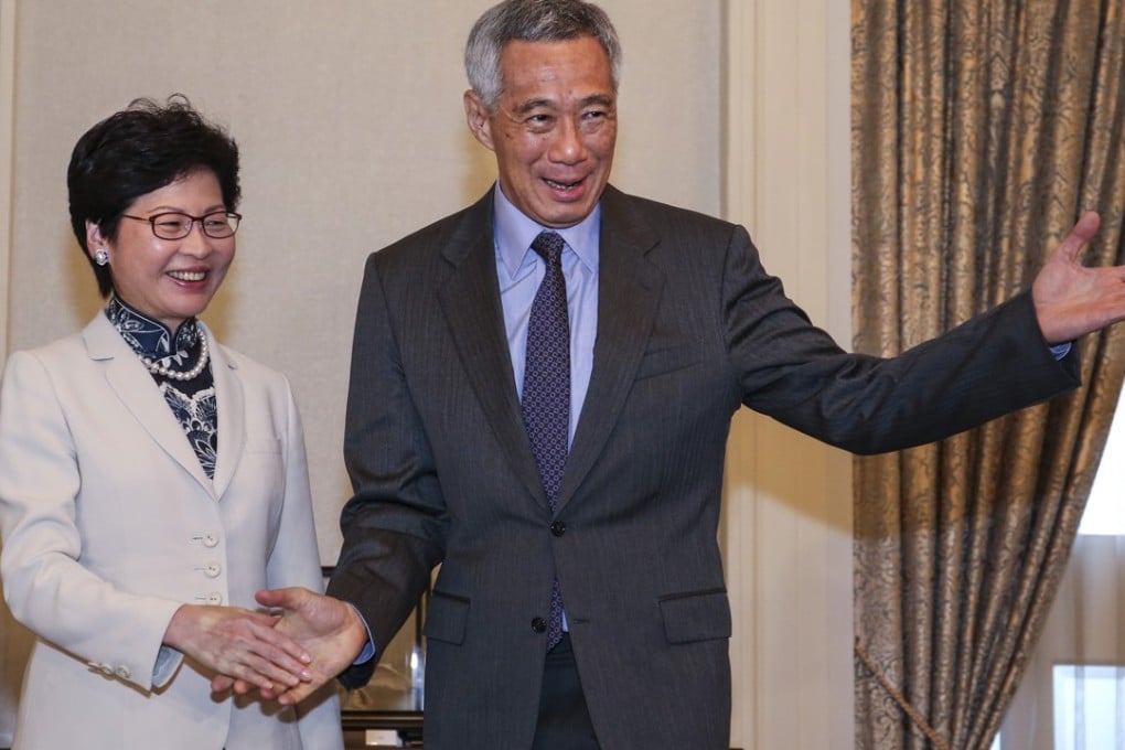 Hong Kong Chief Executive Carrie Lam meets Prime Minister Lee Hsien Loong of Singapore on August 3. Photo: K. Y. Cheng