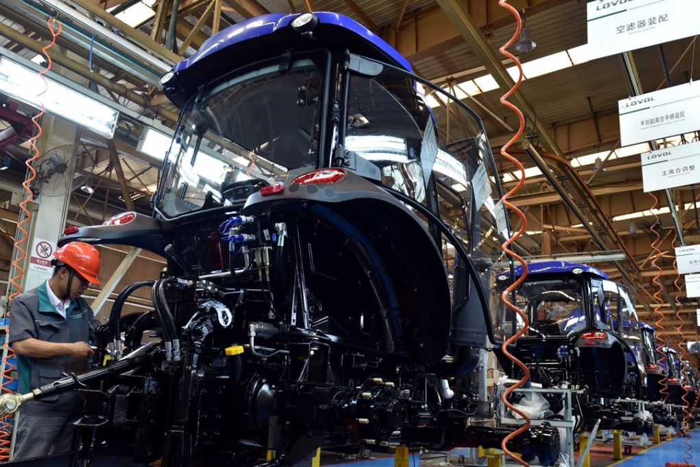 A worker is seen at a tractor assembly line of a company in Weifang, east China's Shandong Province, June 2, 2017. China's gross domestic product expanded 6.9 per cent year on year in the first half of the year to about 38.15 trillion yuan (US$5.62 trillion), data from the National Bureau of Statistics showed. Photo: Xinhua