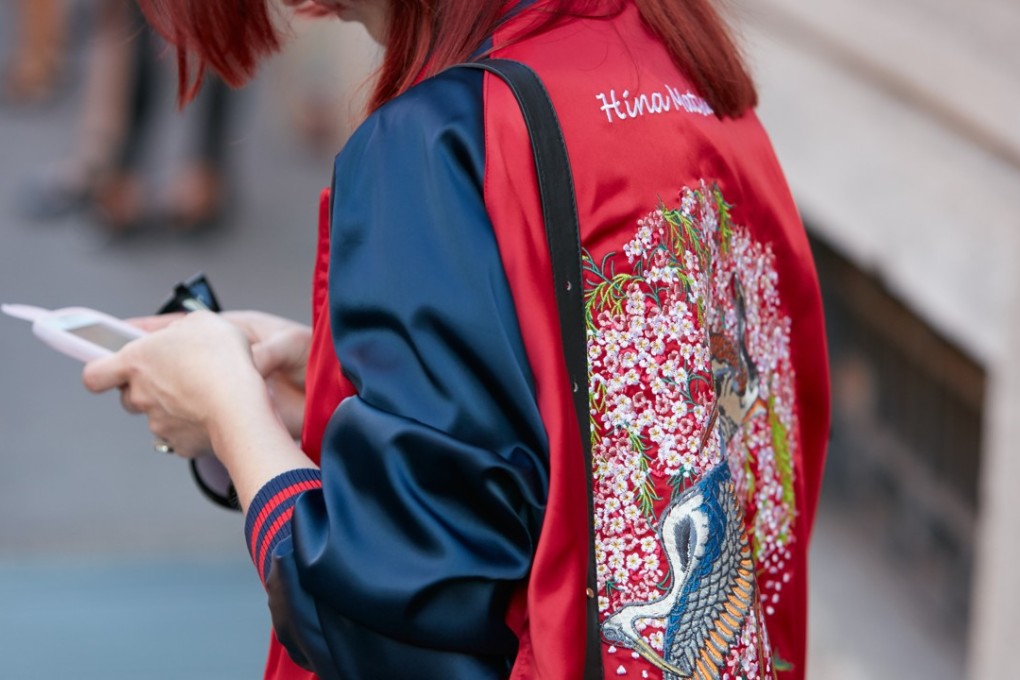 A red and blue satin bomber jacket.