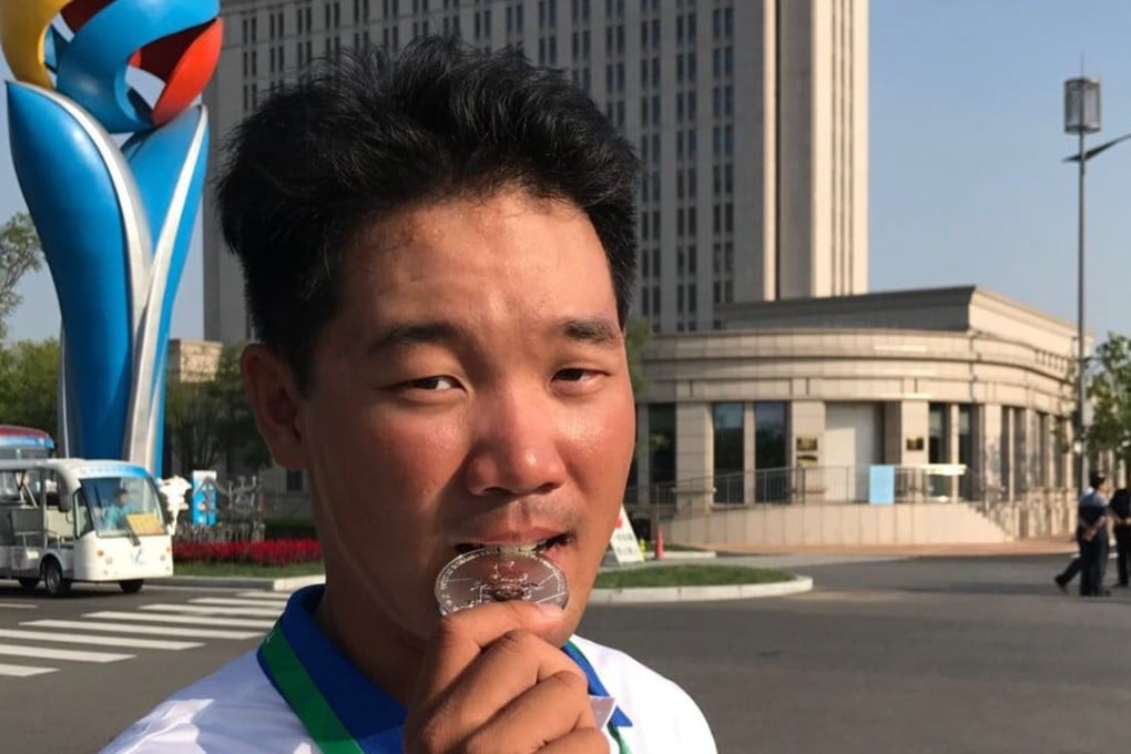 Cheung King-lok with his silver medal in Tianjin. Photo: Handout