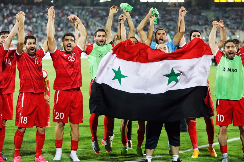 Syria players celebrate after the Fifa World Cup 2018 qualifying draw against Iran put them into a qualification play-off. Photo: EPA