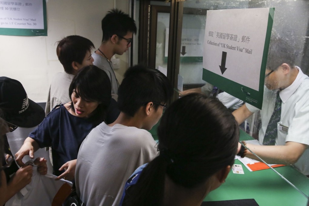 UK-bound students collect their visas from a special counter at the General Post Office in Central, on September 6. Photo: Sam Tsang