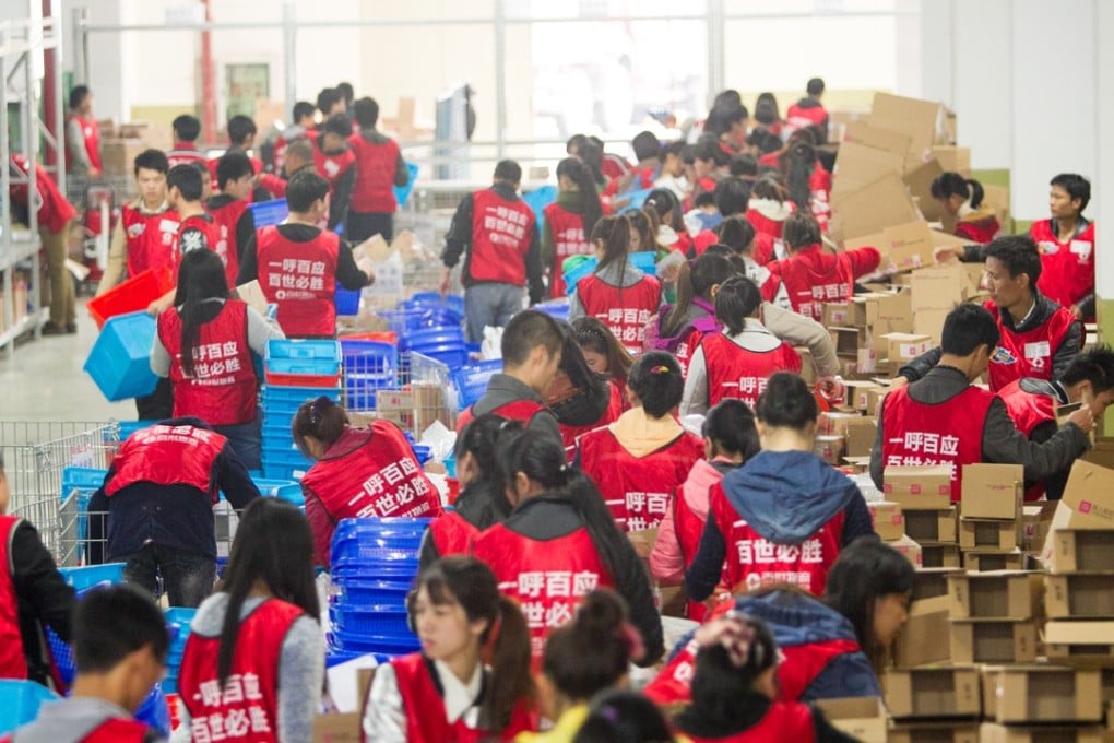 Workers sort out parcels from online shopping at a warehouse of Best Logistics in Shanghai, China. The company has set the price range for its New York IPO. Photo: ImagineChina