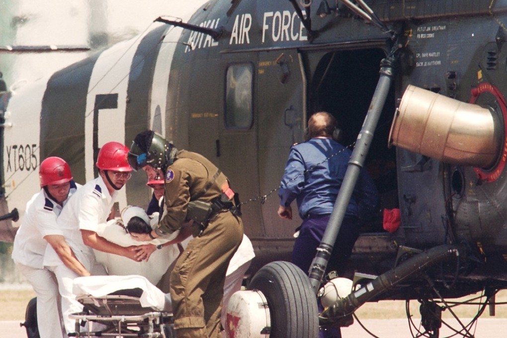 An injured fisherman is transferred to a stretcher at Prince of Wales Hospital in Sha Tin, Hong Kong, after being rescued by a Royal Air Force Wessex helicopter from the Paracel Islands in the South China Sea in a a 24-hour operation.