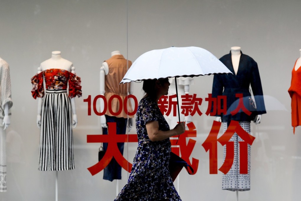 A fashion outlet promotes its summer sale at a shopping mall in Beijing. The number of third-party clothing brands that provide clothes to YCloset has reached several hundred. Photo: AP
