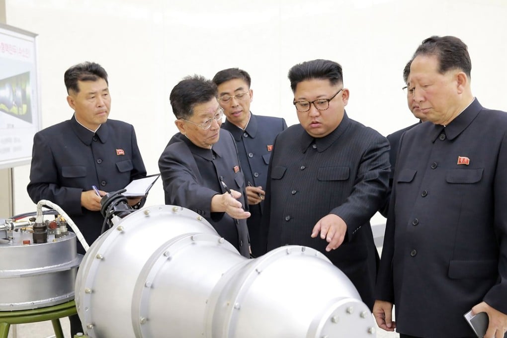North Korean leader Kim Jong-un inspects what is said to be a miniaturised hydrogen bomb. Photo: AFP