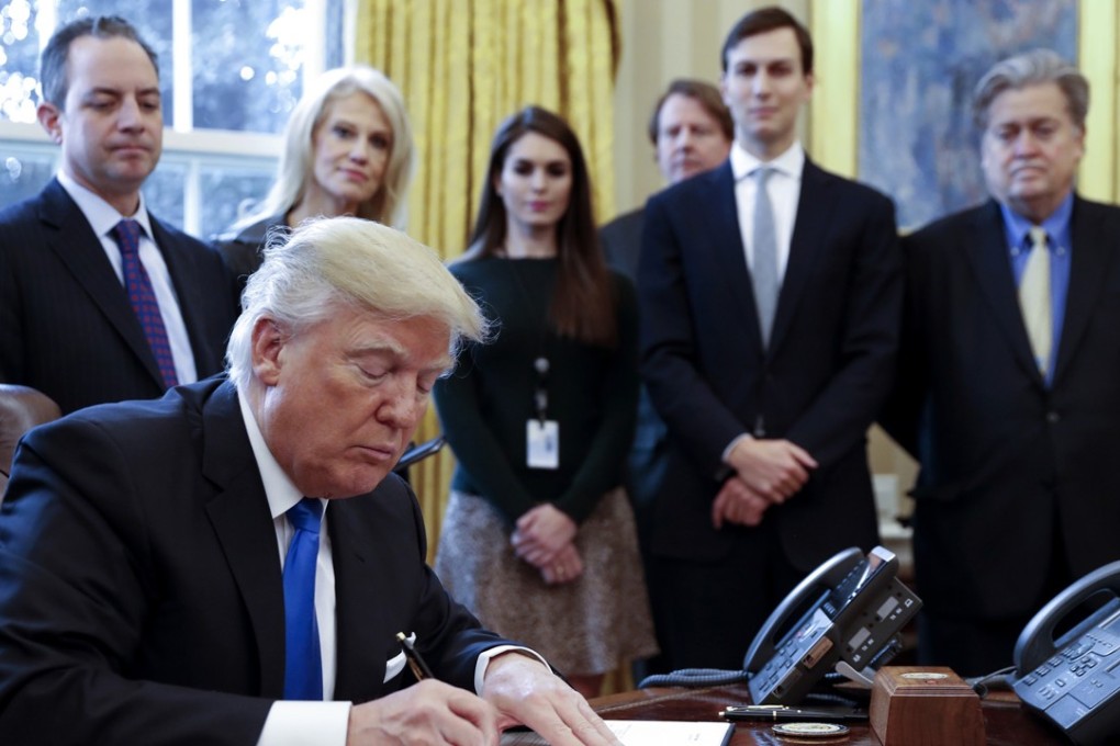 US President Donald Trump and White House Senior Counsellor Steve Bannon at extreme right. Photo: Abaca Press/TNS
