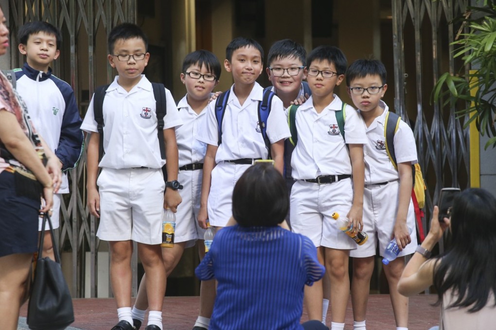Students and parents apply for a Form One place at St Louis School in Sai Ying Pun. Photo: David Wong