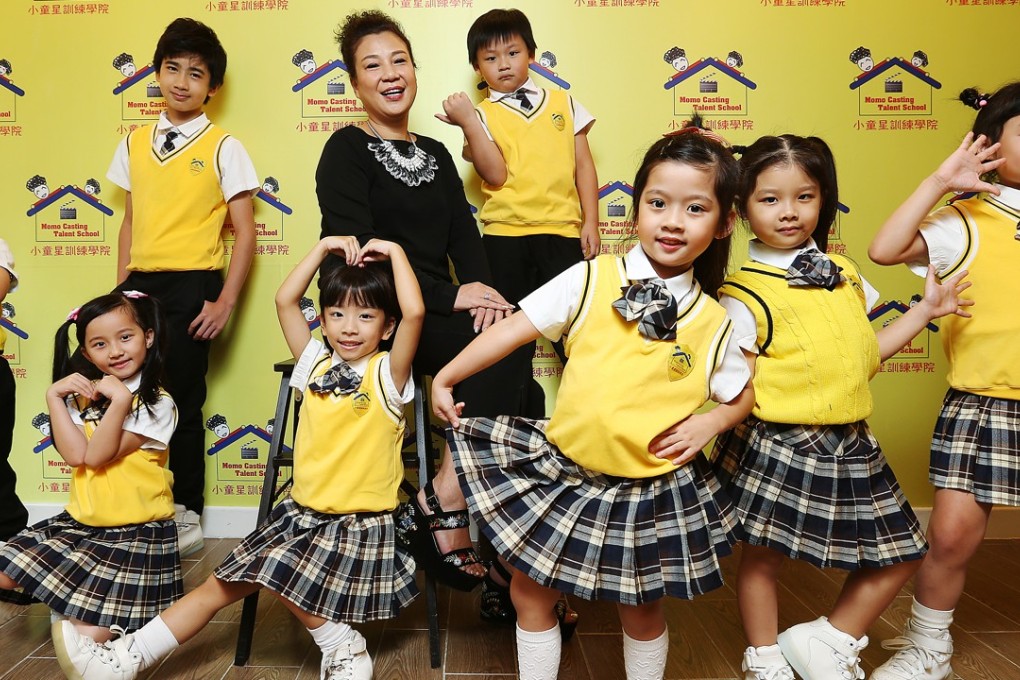 Momo Mo Lai-yee, principal of Momo Casting Talent School with her students. Photo: Xiaomei Chen