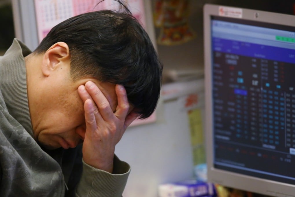 A trader at the Hong Kong Stock Exchange. Photo: Sam Tsang