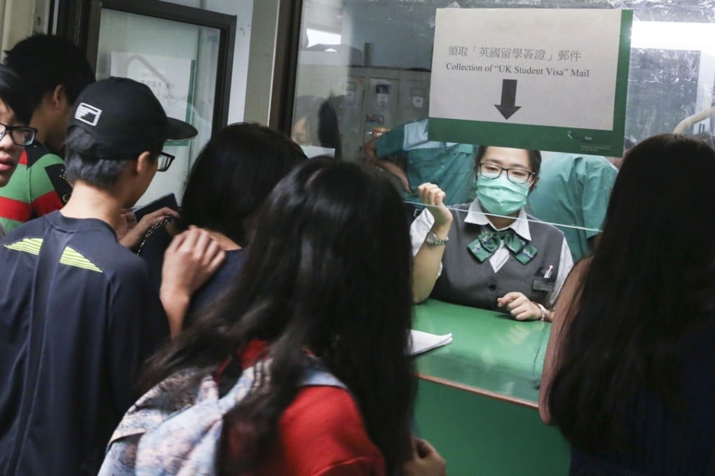 UK-bound students throng the special visa collection counter at the General Post Office in Central, on September 6. Photo: Sam Tsang