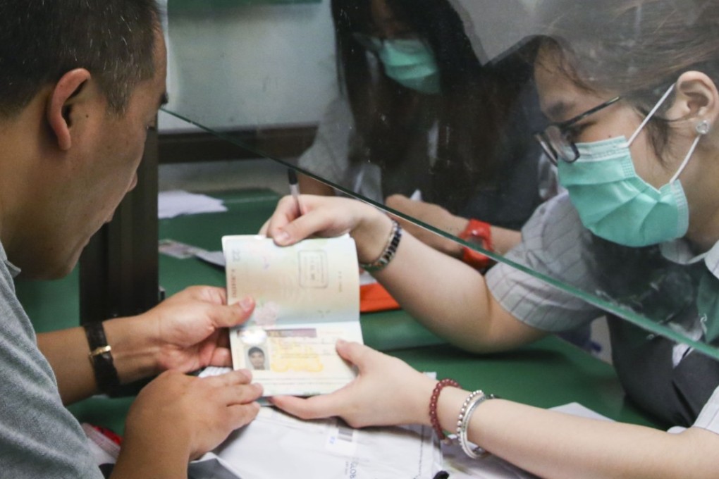 A UK student visa being handled at a special counter of the General Post Office in Central. Photo: Sam Tsang