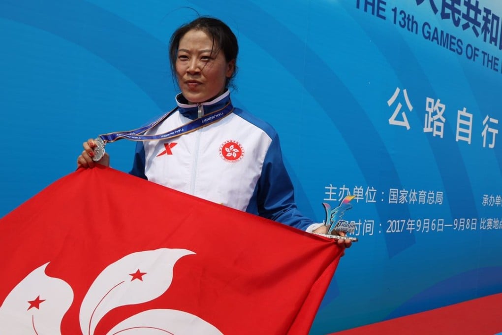 Meng Zhaojuan with her silver medal and the Bauhinia flag. Photo: Hong Kong Cycling Association