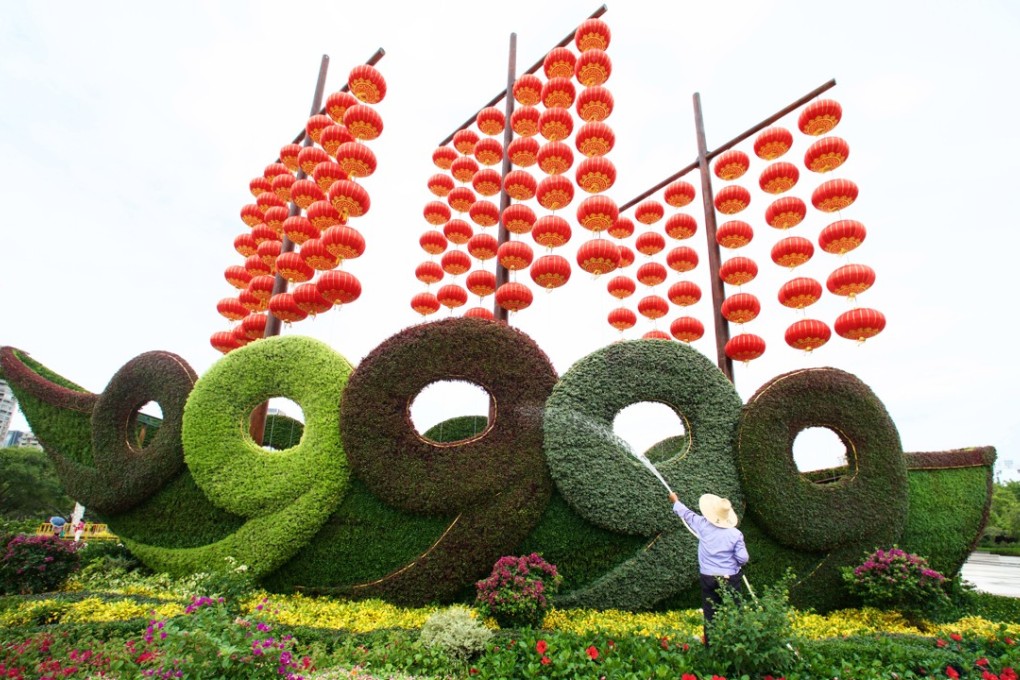 A worker waters flowers at the Bailuzhou Park in Xiamen, ahead of the ninth BRICS summit. Photo: Xinhua