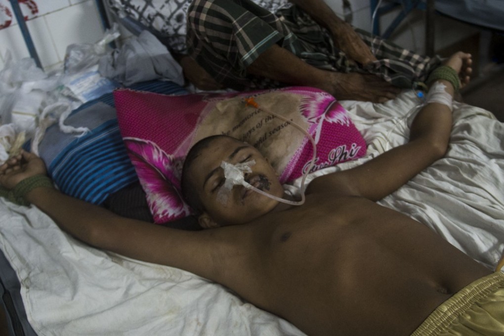 Rohingya refugee Mohammad Junaed is tied to a bed to stop him jumping out of it. Photo: AFP