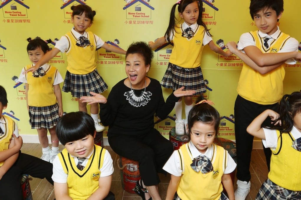 Momo Mo Lai-yee, principal of Momo Casting Talent School with her students. Photo: Xiaomei Chen