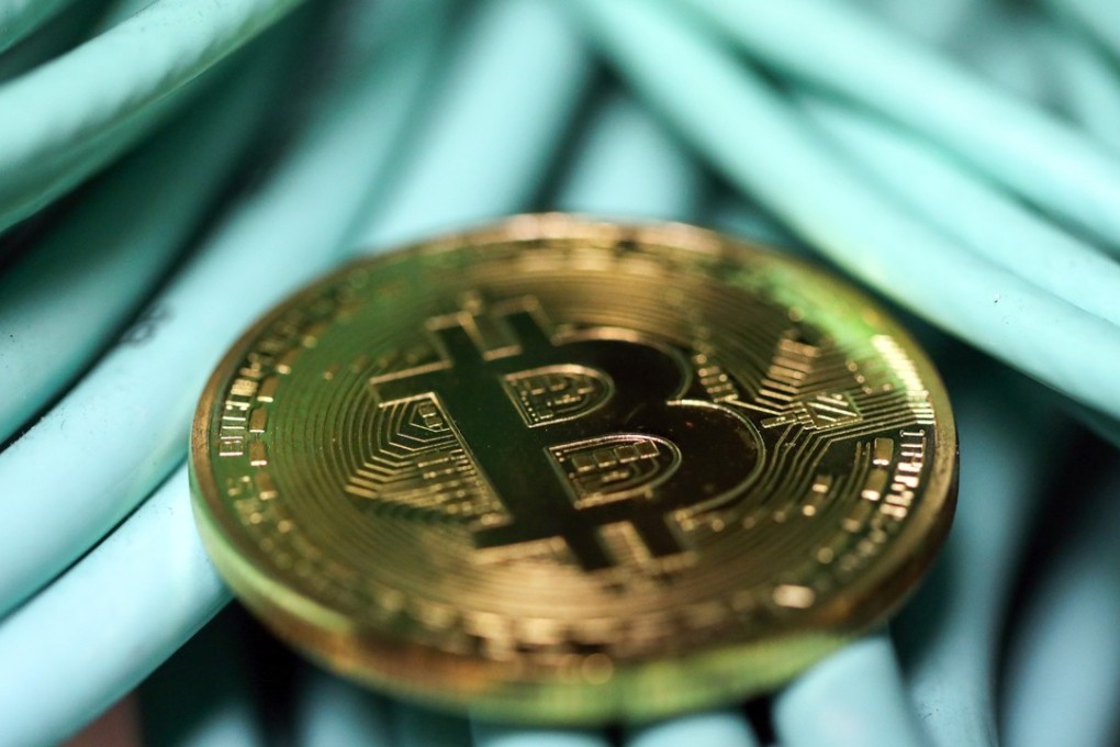 A bitcoin sits on coaxial cables inside a communications room at an office in London. Photo: Bloomberg